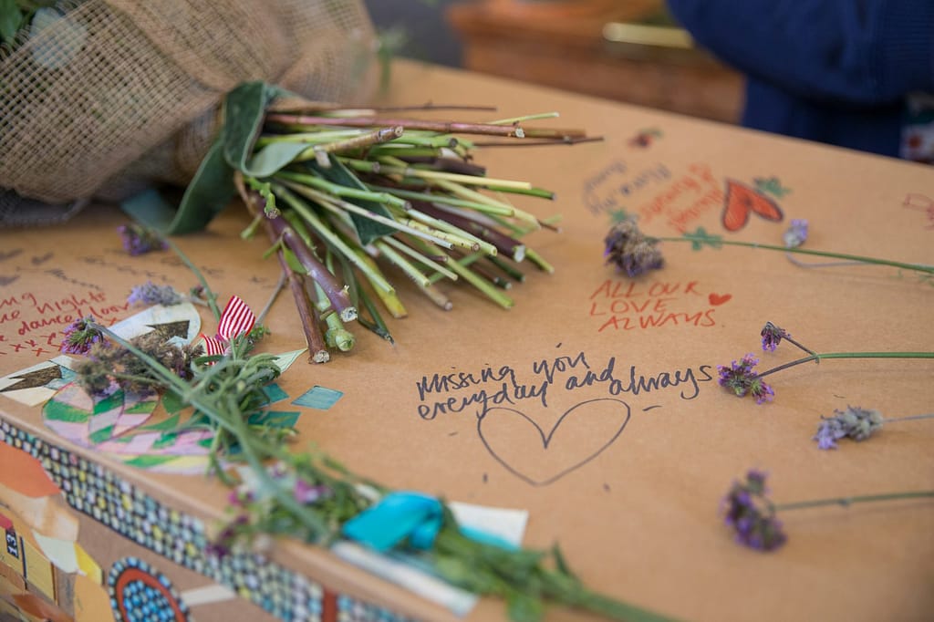 a bunch of flowers sitting on top of a box