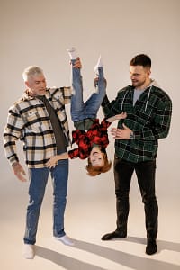Two dads and their child having Fun