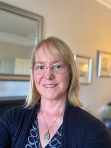 Fleur smiling from her lounge