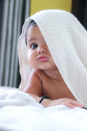 Baby in white bath towel