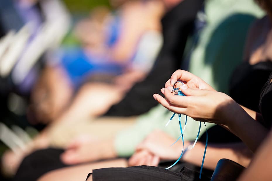 Guest holding rings to bless and send good wishes to the couple